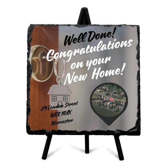 Personalised housewarming gift stone slate plaque with custom design, featuring a congratulatory message and key graphic.